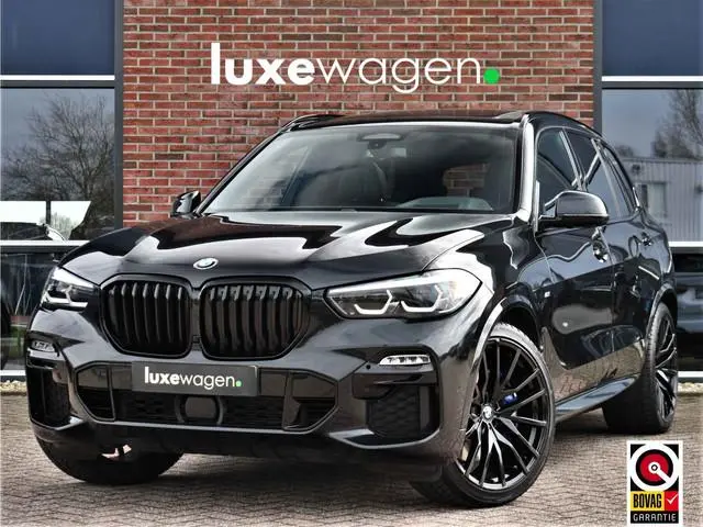 BMW X5 xDrive45e M-Sport SkyLounge M-zetels 4WS ACC Trekh 360 2xTV Carbon HUD